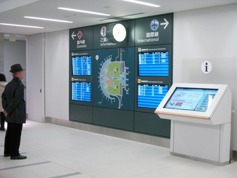 Guide map and flight displays are installed together on the wall